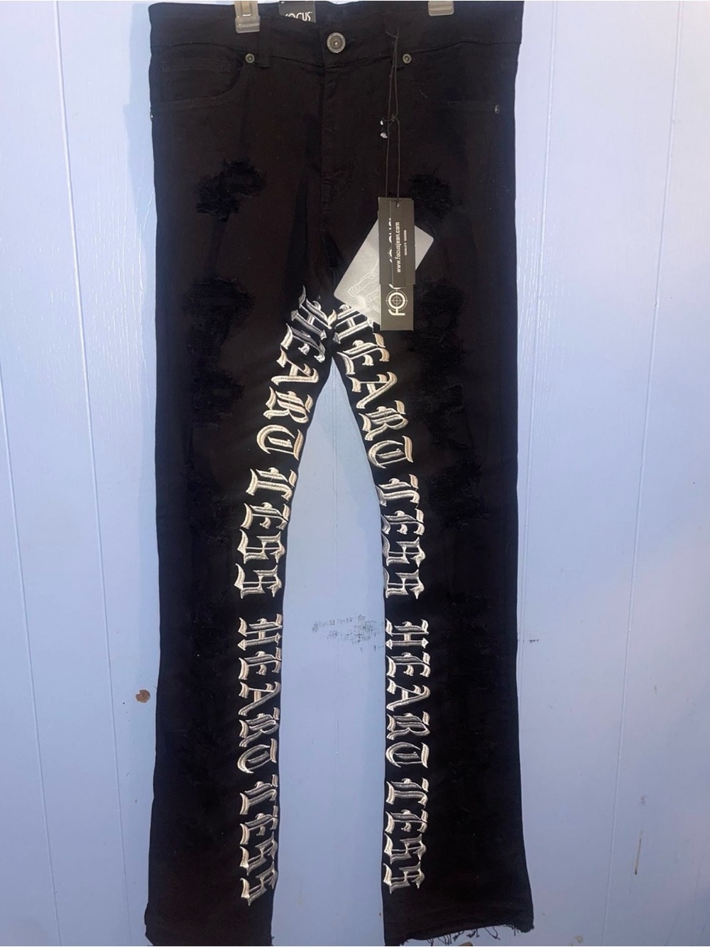 Focus Black Distressed heartless logo stacked flared jeans